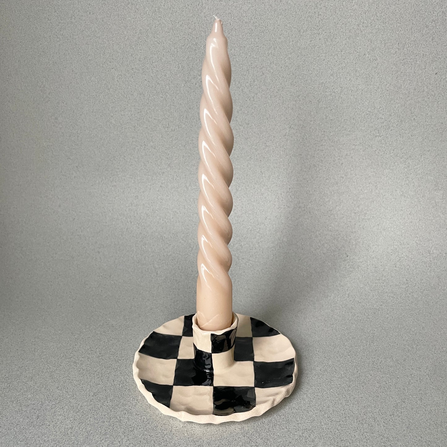 black checkered candle holder