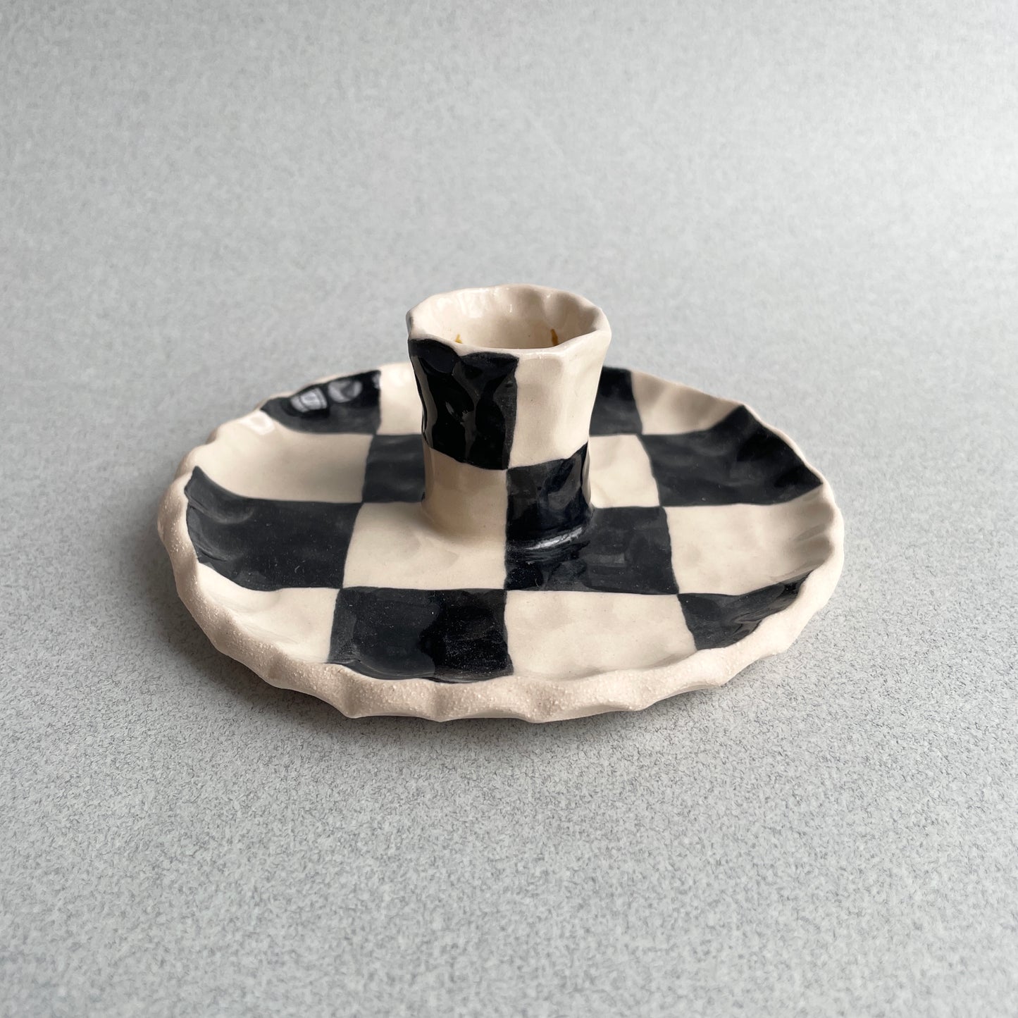 black checkered candle holder
