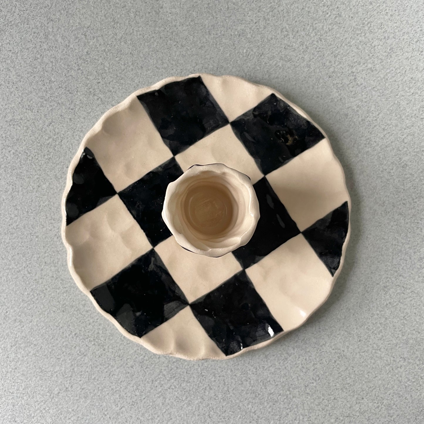 black checkered candle holder