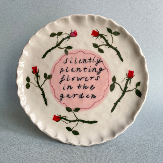 silently planting flowers